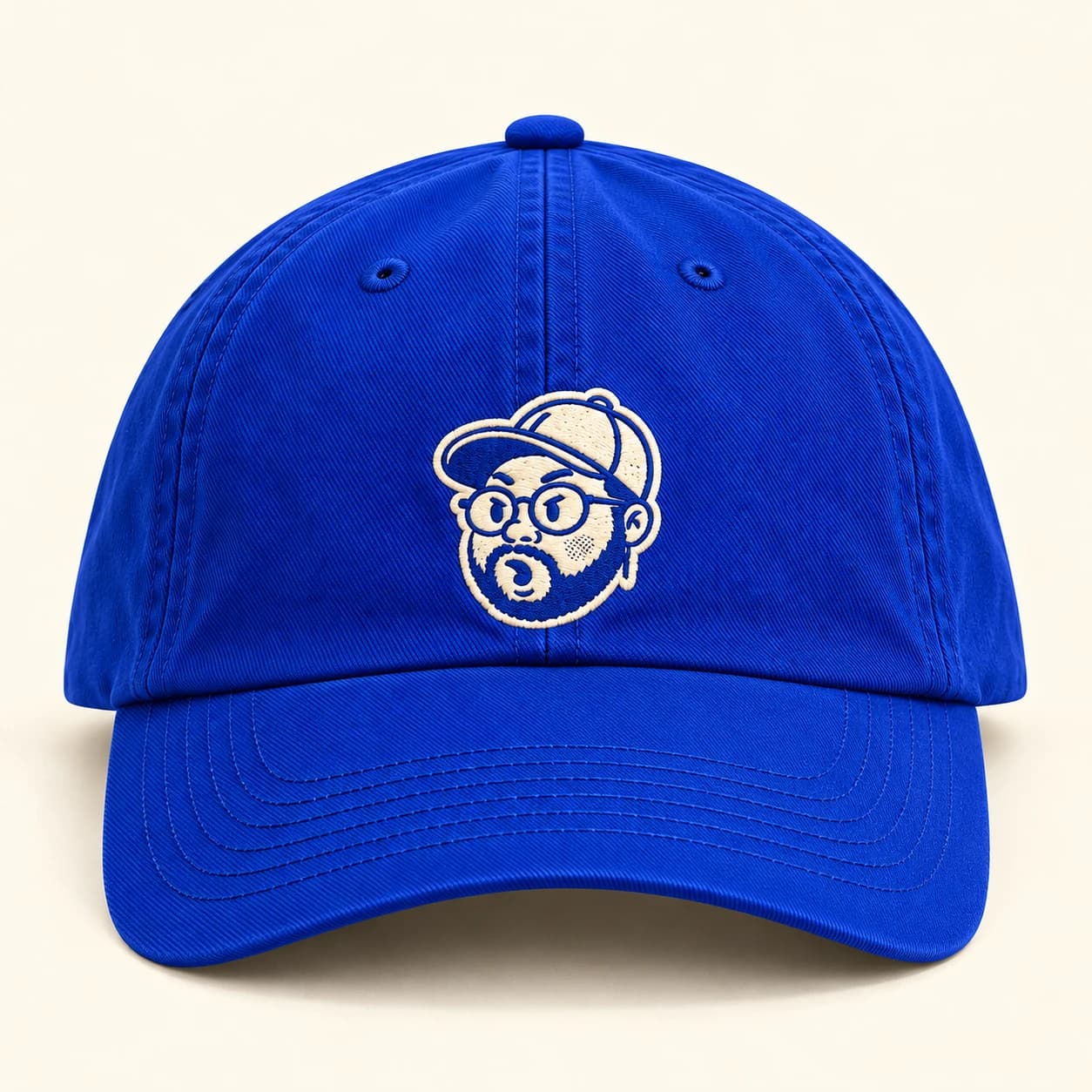 Cobalt cap, front view, with the embroidered mascot face